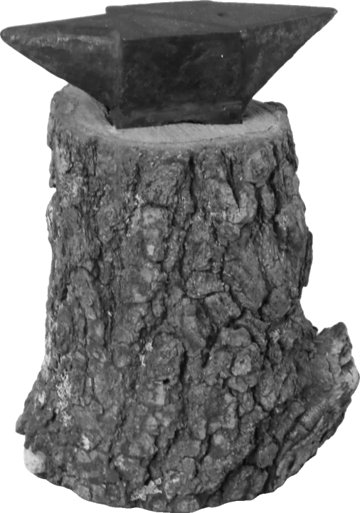 An anvil on a tree-stump base